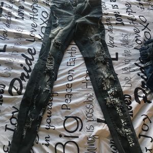 Distressed black and grey jeans